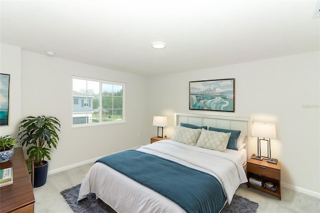 bedroom featuring light colored carpet