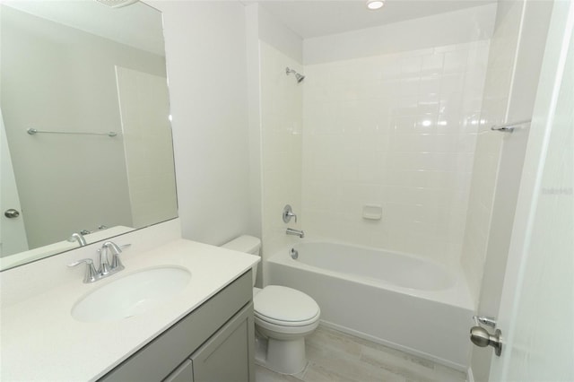 full bathroom with shower / washtub combination, wood-type flooring, vanity, and toilet