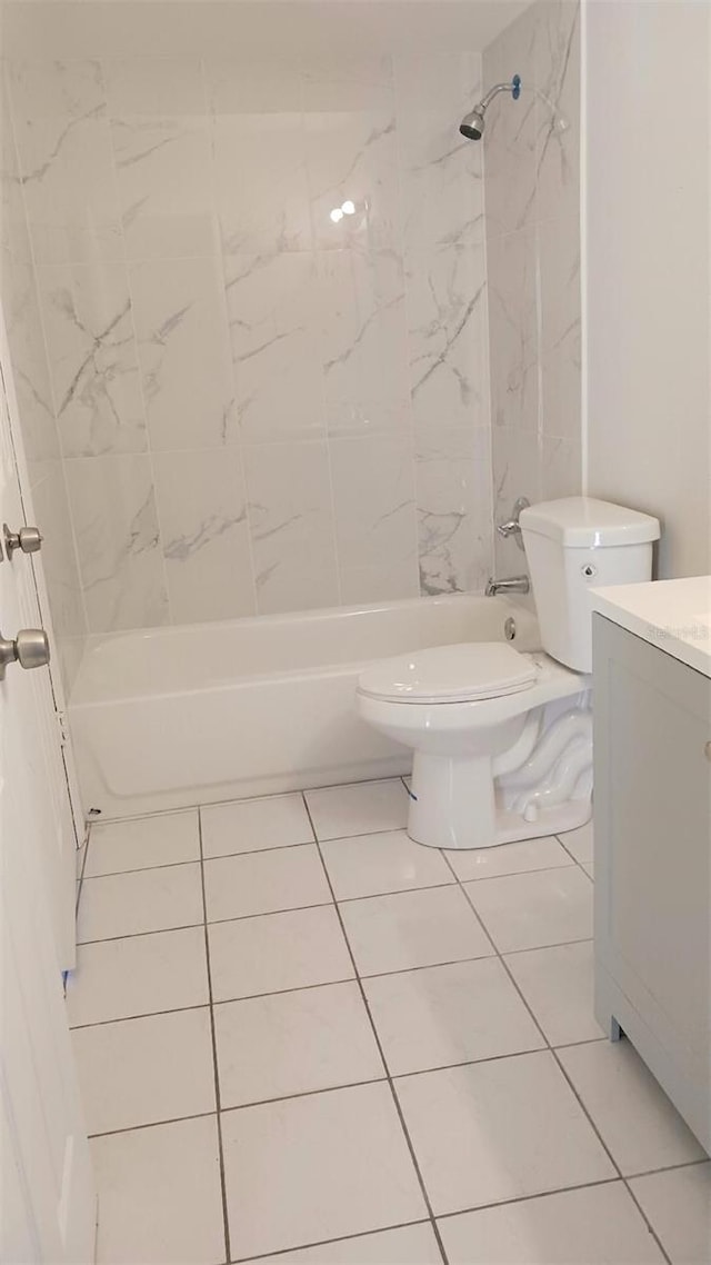 bathroom with tile patterned floors, vanity, and toilet