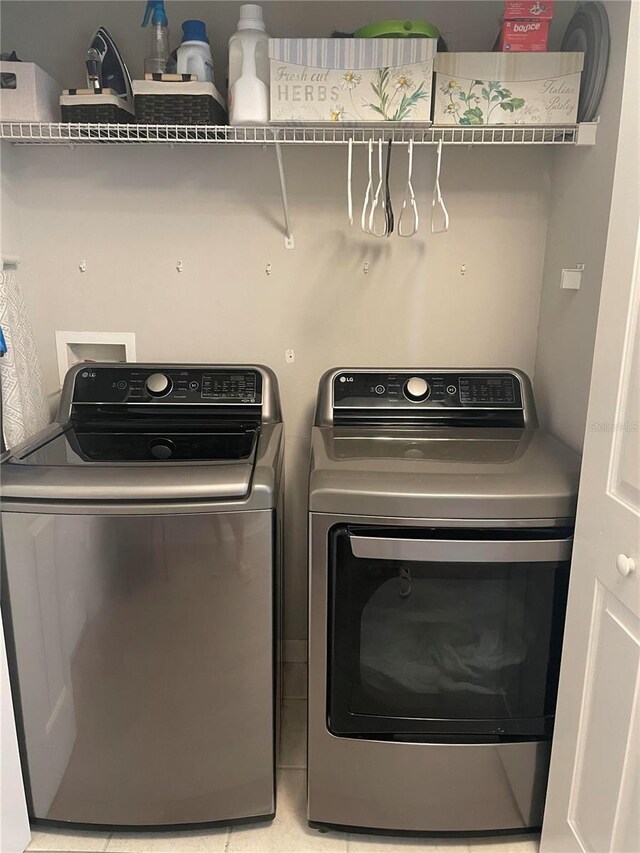 770 Siena Palm Dr Unit 201, Celebration, FL 34747 - laundry room with washing machine and dryer and laundry area