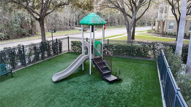 770 Siena Palm Dr Unit 201, Celebration, FL 34747 - communal playground featuring fence and a lawn