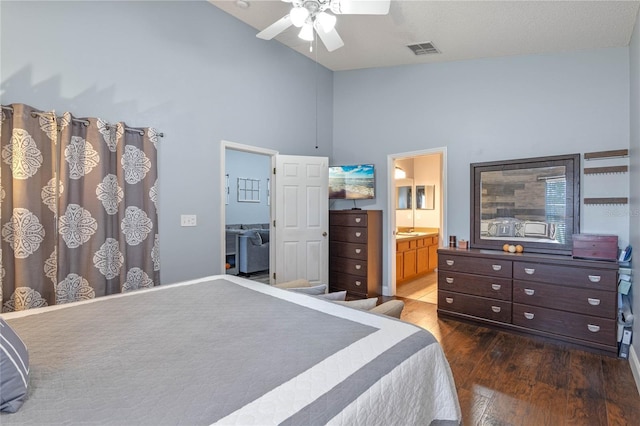 bedroom featuring ensuite bathroom, ceiling fan, high vaulted ceiling, and dark hardwood / wood-style flooring