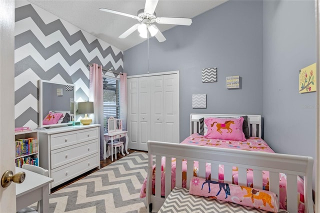 bedroom featuring a closet, lofted ceiling, and ceiling fan