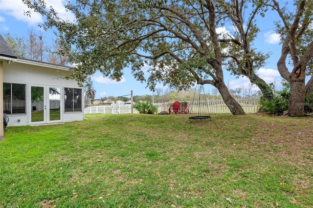 view of yard with french doors