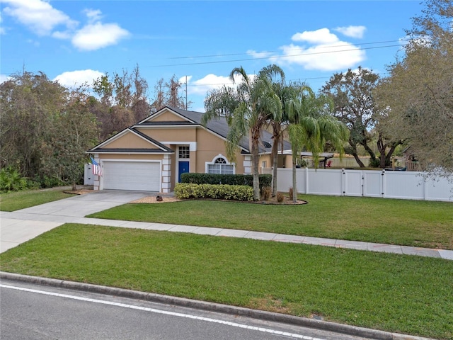 view of front facade with a front yard and a garage