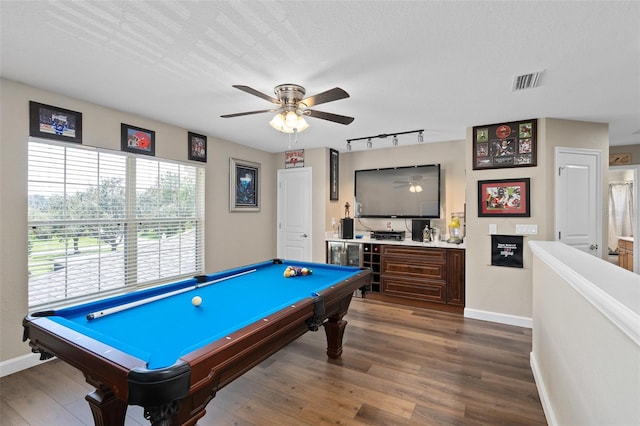 game room with pool table, ceiling fan, hardwood / wood-style floors, and a textured ceiling