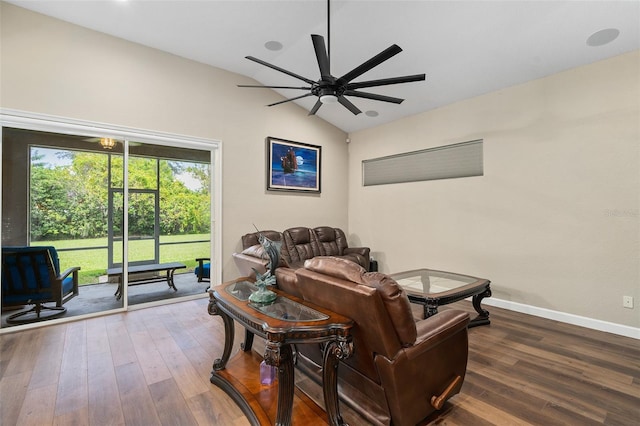 living room with hardwood / wood-style flooring, lofted ceiling, and ceiling fan