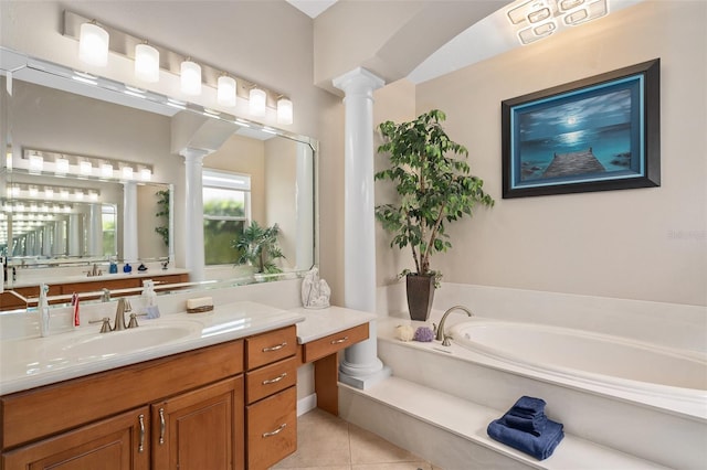 bathroom with vanity, a bath, tile patterned flooring, and decorative columns