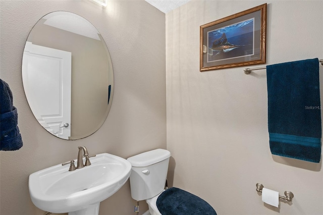 bathroom with sink and toilet