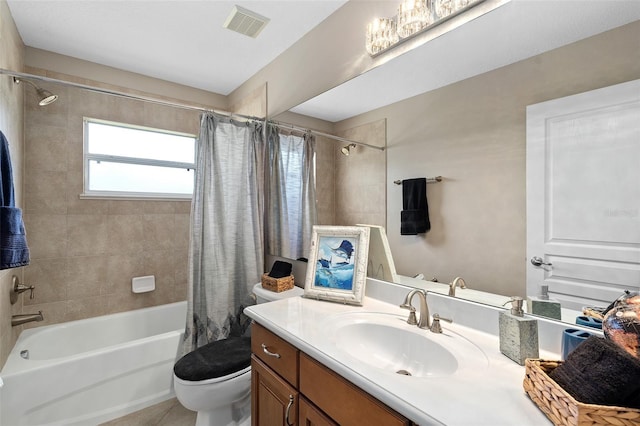 full bathroom with vanity, toilet, and shower / bath combo