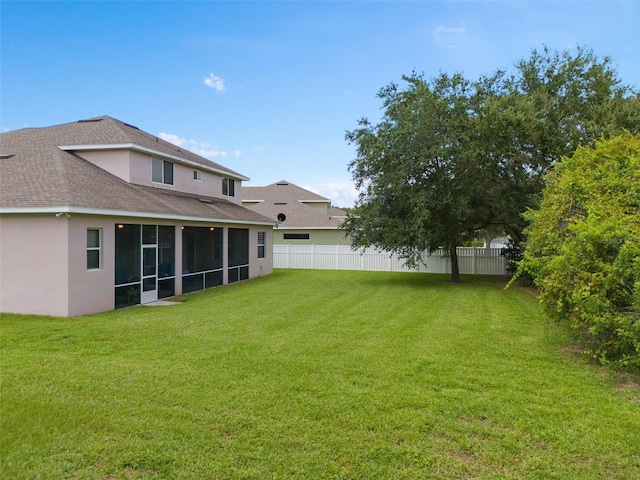 view of yard featuring a sunroom