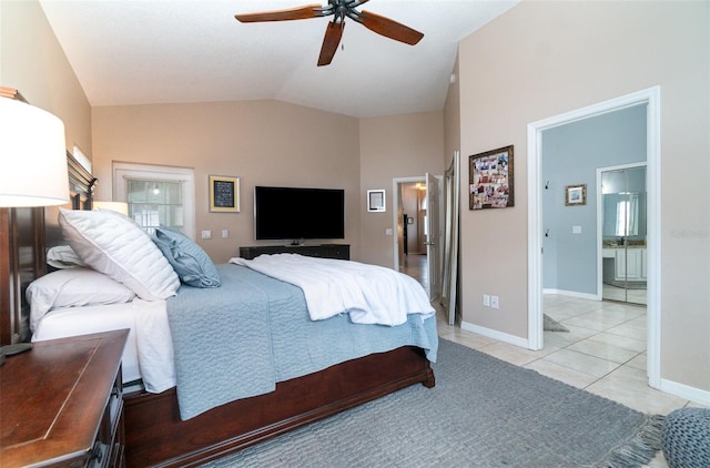 bedroom with lofted ceiling, light tile patterned flooring, ceiling fan, and ensuite bath