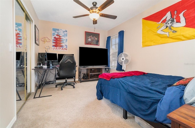 carpeted bedroom featuring ceiling fan