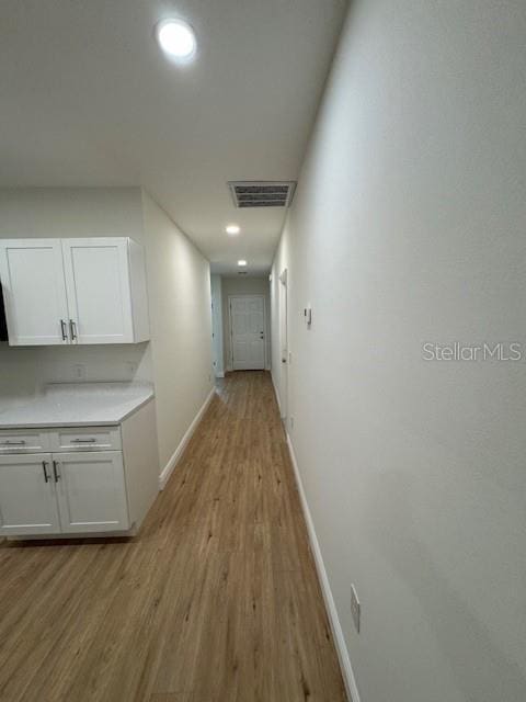 hallway featuring light wood-type flooring