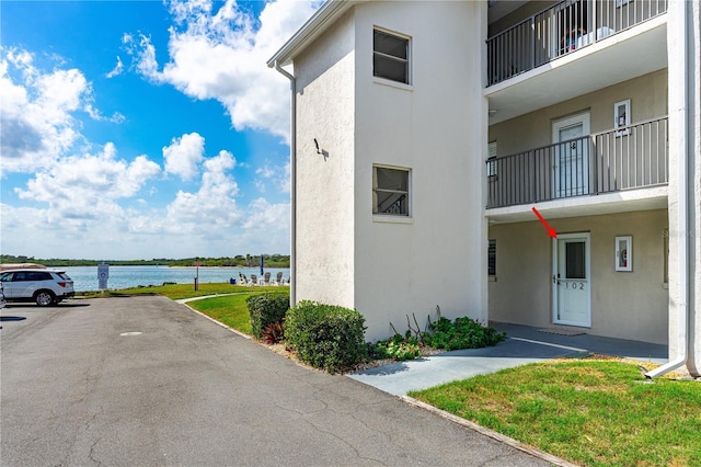 view of building exterior featuring a water view