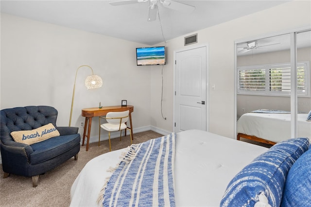 carpeted bedroom featuring visible vents, ceiling fan, and baseboards