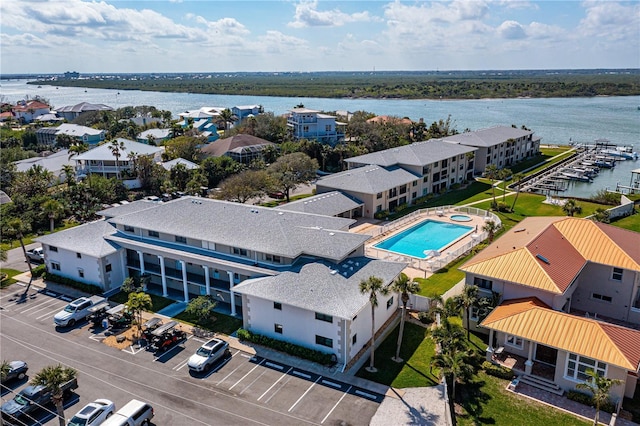 birds eye view of property featuring a residential view and a water view