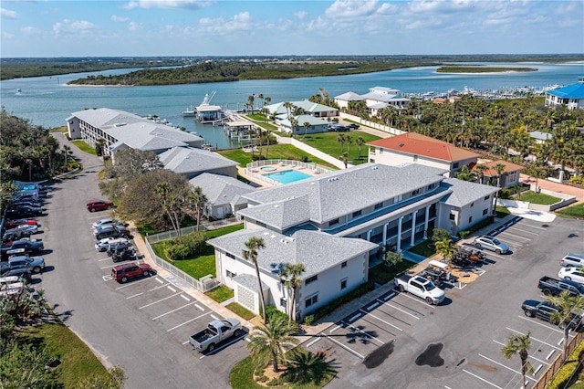 birds eye view of property with a water view