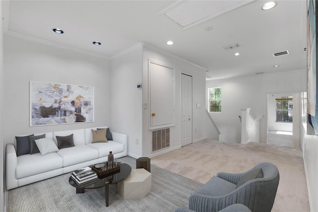 living room with carpet floors, visible vents, and ornamental molding