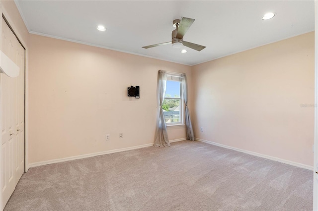 unfurnished bedroom with crown molding, recessed lighting, a closet, light carpet, and baseboards