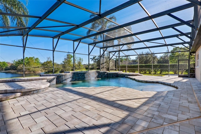 pool with a lanai, a patio area, and a jacuzzi