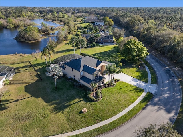 bird's eye view with a water view and a view of trees