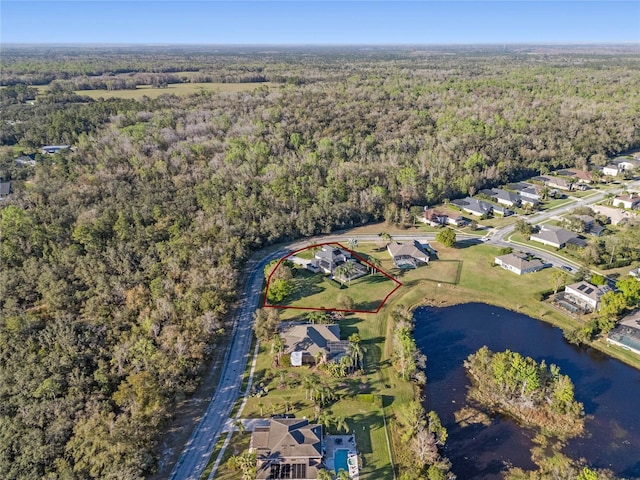 aerial view with a water view, a residential view, and a view of trees