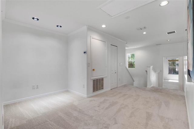 carpeted empty room with recessed lighting, visible vents, and crown molding