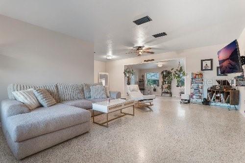 living room with ceiling fan