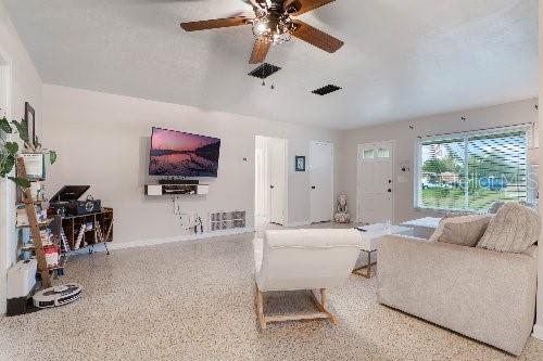 living room with ceiling fan