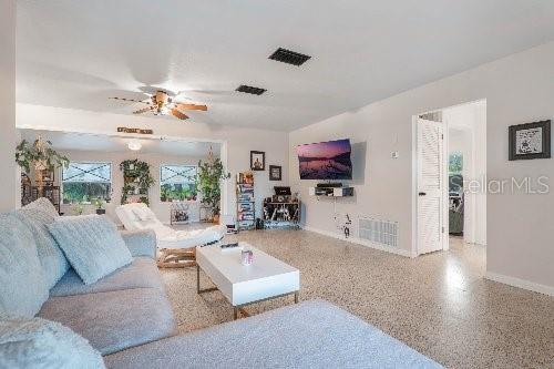 living room featuring ceiling fan