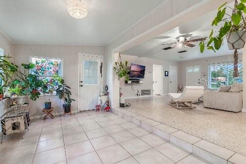 unfurnished living room featuring ceiling fan