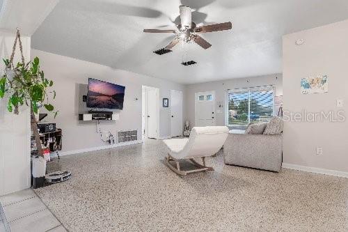 living room featuring ceiling fan