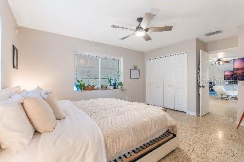 bedroom featuring ceiling fan and a closet