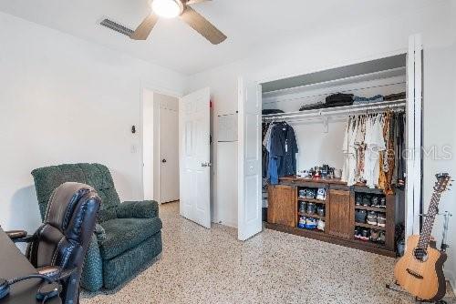 interior space featuring ceiling fan