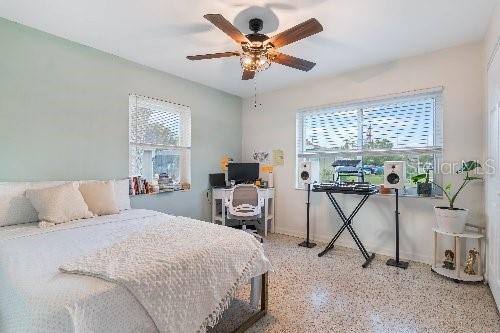 bedroom featuring multiple windows