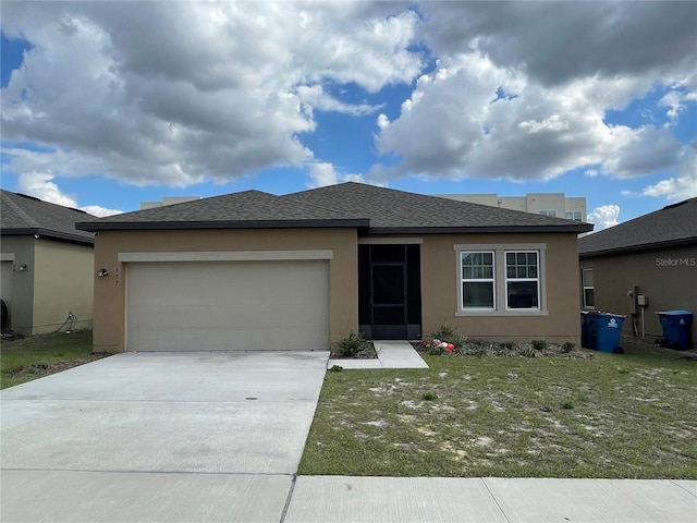 view of front facade with a garage and a front yard