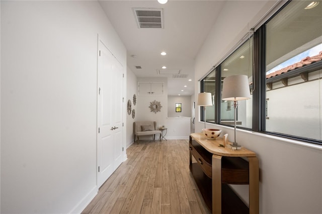 corridor featuring light hardwood / wood-style floors