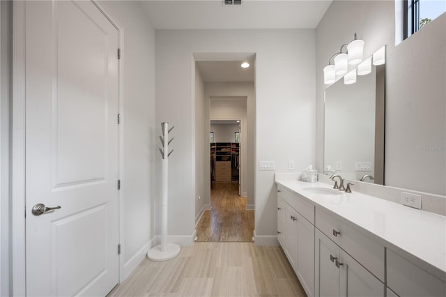 bathroom with vanity and hardwood / wood-style flooring