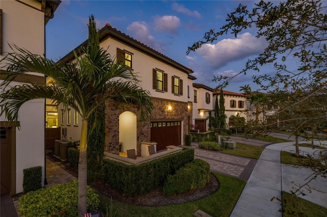 mediterranean / spanish house with a garage