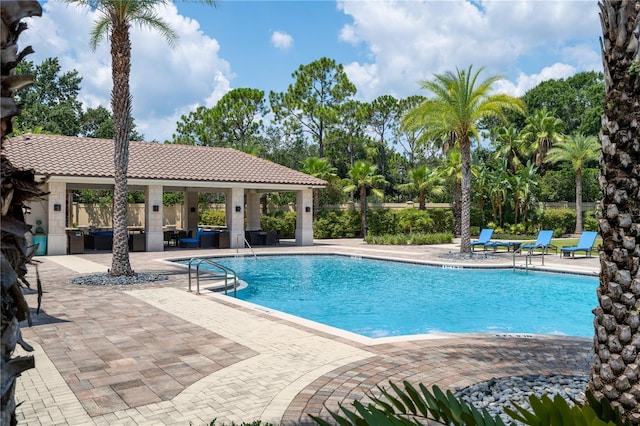 view of pool with a patio and a gazebo