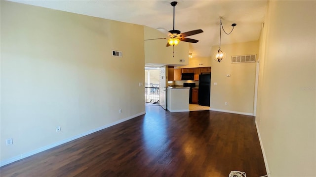 unfurnished living room with high vaulted ceiling, hardwood / wood-style floors, and ceiling fan