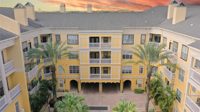 view of outdoor building at dusk