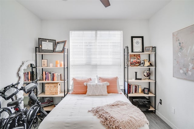 bedroom with hardwood / wood-style flooring and ceiling fan