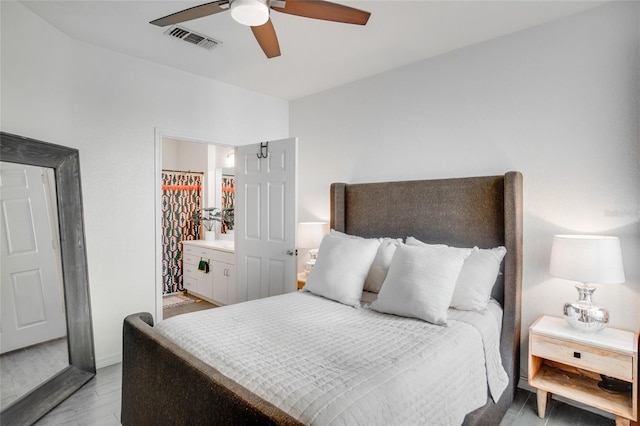 bedroom with ceiling fan and light wood-type flooring