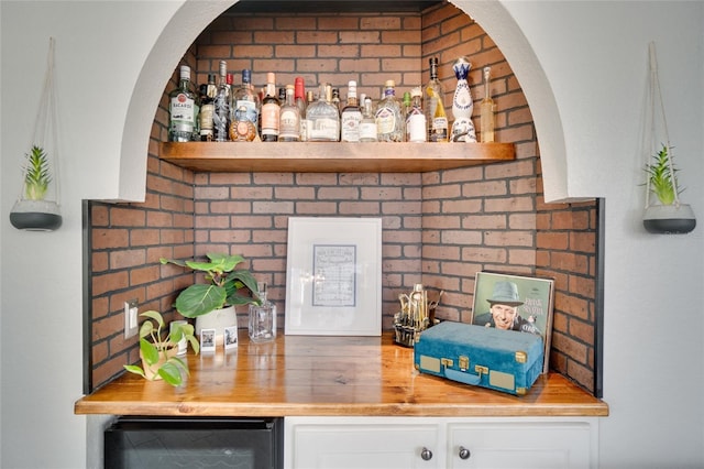 bar with wood counters and wine cooler