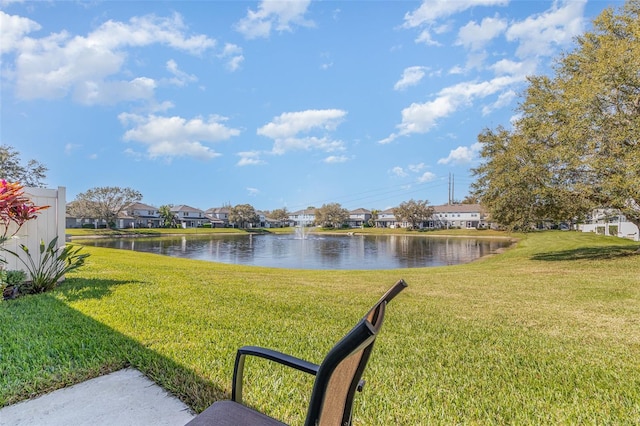 view of yard with a water view and a residential view