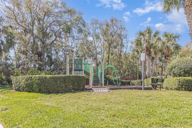 community playground featuring a lawn