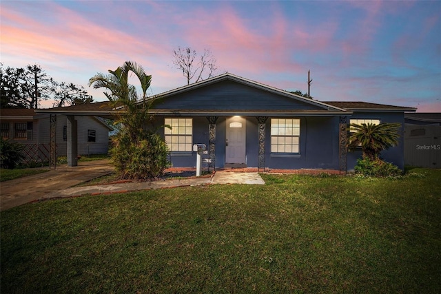 ranch-style house with a lawn