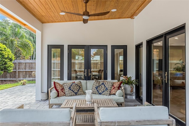 view of patio featuring an outdoor living space, ceiling fan, and french doors